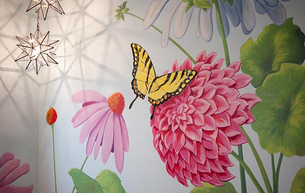 butterfly on top of flower mural