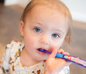 Child brushing teeth