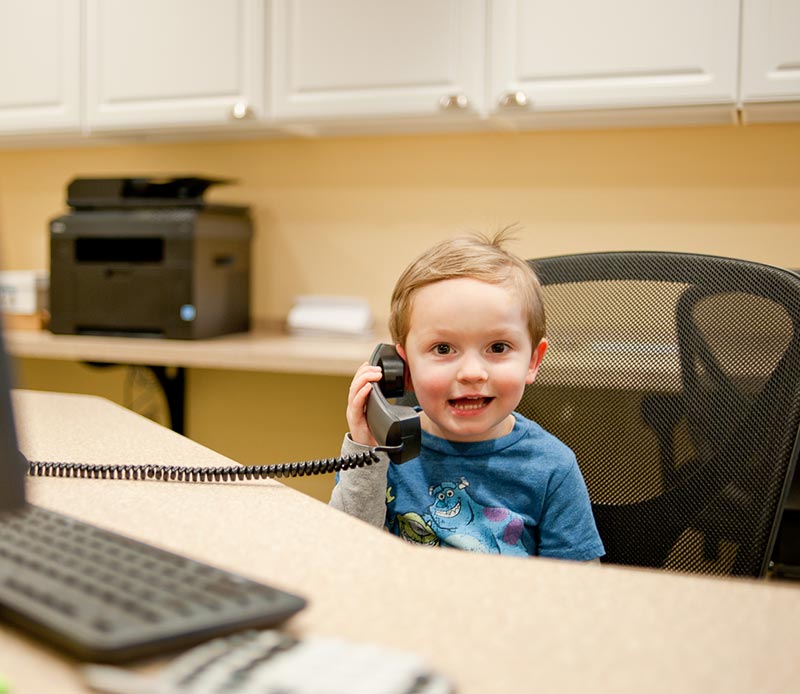 child answering phone
